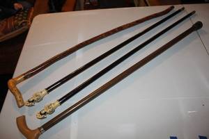 lot 108 image: antique walking canes featuring decorative handles