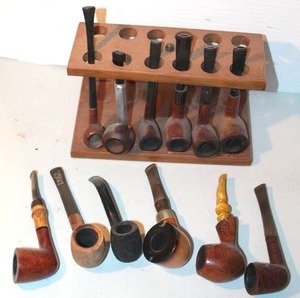 lot 141 image: collection of vintage tobacco smoking pipes, featuring various shapes and wooden finishes with display took pictures of a lot