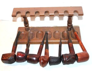 lot 142 image: collection of vintage tobacco smoking pipes, featuring various shapes and wooden finishes with wood display took pictures of all