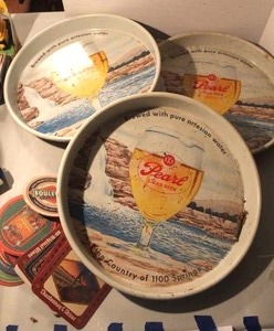 lot 154 image: vintage Pearl Lager Beer serving trays and vintage cardboard bar beer coasters.