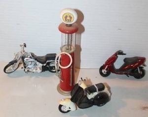 lot 170 image: vintage-style Dixie gas pump and diecast scooters and bike