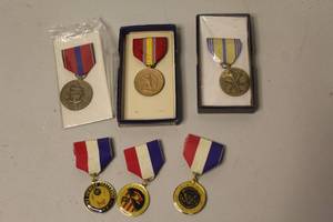 lot 197 image: collection of vintage United States military medals, featuring items like the National Defense Service Medal and various campaign awards