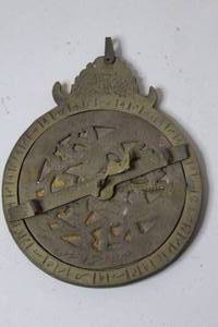 lot 241 image: a Middle Eastern or Islamic brass astrolabe