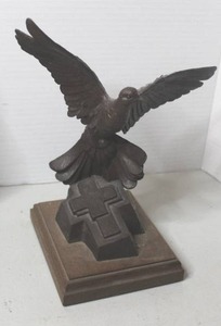 lot 242 image: cast-iron eagle sculpture featuring a dark finish and a wooden base