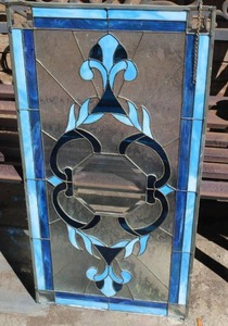 lot 277 image: Tiffany style hanging stained glass window panel with a blue and white design about 17x34
