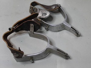 lot 326 image: pair of vintage nickel plated or stainless steel rodeo spurs with leather straps