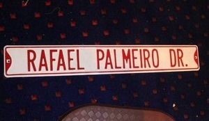 lot 344 image: decorative street sign featuring the name of former MLB player Rafael Palmeiro DR.