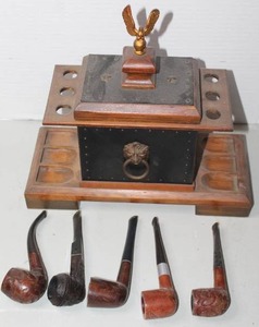 lot 361 image: vintage wood pipe rack and humidor set featuring a lid topped with an eagle finial and a collection of vintage tobacco pipes
