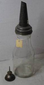 lot 372 image: vintage 1-quart glass motor oil bottle with a metal spout from the 1920s-1940s. & vintage small metal thumb pump oil can