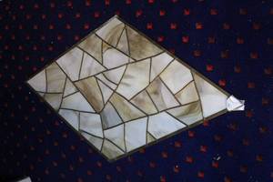 lot 413 image: stained glass panel featuring neutral tones like beige and brown about 28x45