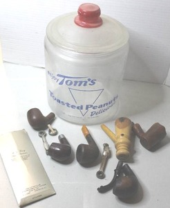 lot 427 image: vintage Toms Toasted Peanuts advertising jar with pipes and parts