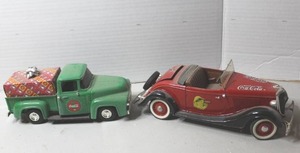 lot 453 image: red Solido diecast model of a 1934 or 1936 Ford V8 Roadster with Coca-Cola branding & vintage green ERTL Company 1956 Ford Coca-Cola pickup truck die-cast model featuring a festive Christmas load