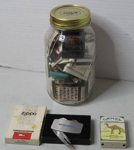 lot 477 image: vintage 1968 Zippo Greenskeeper golf tool featuring BF Goodrich advertising, complete with its original box & vintage Camel cigarettes hard pack flip top lighter.& vintage Mason jar filled with a collection of matchbooks