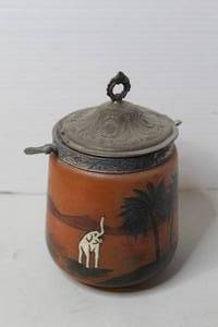 lot 480 image: vintage hand-painted stoneware biscuit barrel featuring a desert elephant motif and a metal lid