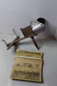 lot 484 image: This is an antique stereoscope viewer, likely from the late 19th or early 20th century stack of stereoview cards