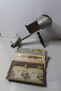 lot 485 image: This is an antique stereoscope viewer, likely from the late 19th or early 20th century stack of stereoview cards