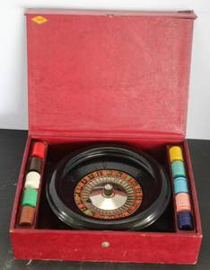 lot 499 image: vintage E.S. Lowe roulette game set featuring a Bakelite wheel inside a burgundy carrying case
