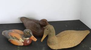lot 507 image: vintage hand-carved wooden duck decoys featuring different styles and wood types and one has cloth over it