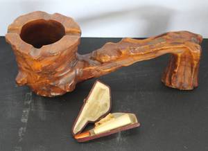 lot 513 image: vintage, hand-carved wooden pipe-shaped ashtray & vintage meerschaum cheroot holder featuring a carved animal figure and an amber-colored mouthpiece, housed in its original case