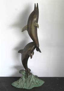 lot 521 image: vintage statue of a pair of jumping dolphins on a wave base