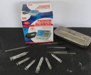 lot 525 image: Premium Automatic Blood Pressure Monitor. & a set of glass syringes and plastic pipettes