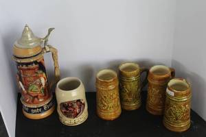 lot 530 image: vintage German-style beer steins made of ceramic & vintage German beer steins and more see pictures for details
