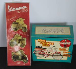 lot 534 image: vintage 1998 Coca-Cola Mini Delivery Bike collectible in its original packaging & Nostalgic-Art Vespa Model Chart magnet set