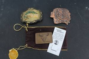 lot 566 image: Raintree brand bass fish belt buckle & vintage Indiana Metal Craft Native American Chief belt buckle & vintage belt buckle featuring a C.M. Russell Buffalo Skull design