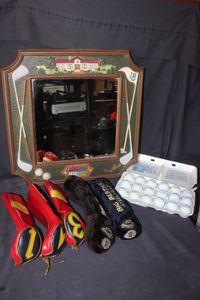 lot 66 image: Golf Themed Home Decor Mirror, Golf Club Covers and 18 Golfballs secured in egg carton