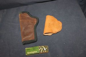lot 87 image: Two leather gun holsters and box of ammunition for a 22. MUST BE 21 TO PURCHASE