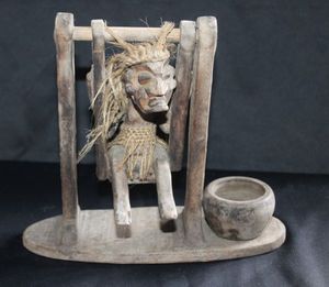 lot 22 image: Handmade wooden primitive tribal swinging man statue