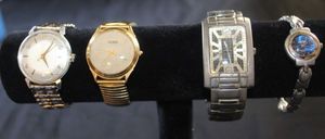 lot 112 image: Four Vintage Watches Timex 100 manual wind wristwatch, Guess, Kenneth Cole, Craig ladies quartz watch featuring a silver-tone integrated link bracelet and blue metallic face.&nbsp
