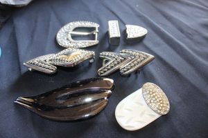 lot 117 image: Belt Buckles, including a mother of pearl Buckle