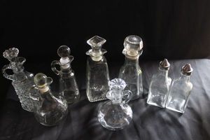 lot 218 image: Vintage Cruetoil bottles with lidsstoppers