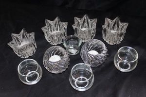 lot 219 image: Collection featuring Kosta Boda crystal candle holders including tulip-shaped designs, by Rolf Shinnermark originating from Sweden and other various styles of Sweden art glass votive holders