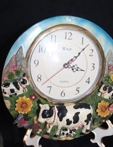 lot 220 image: La Cardo Collection clock featuring a hand painted cow grazing pasture scene