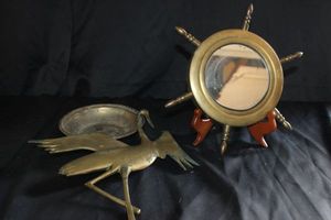 lot 222 image: Nautical Vintage style Maritime decor pieces made from brass featuring a ship wheel and bird for wall handing
