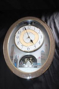 lot 10 image: A Rhythm Small World Cuorum Magic Motion Musical Wall Clock&nbsp