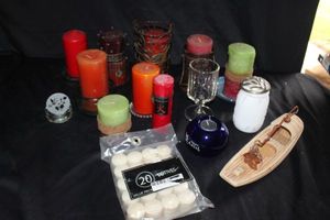 lot 237 image: Generous selection of candles in variety of colors, patterns, and sizes along with some candle holders