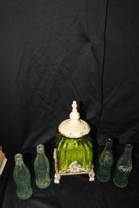 lot 302 image: Vintage glass Coke bottles & vintage green glass footed jar