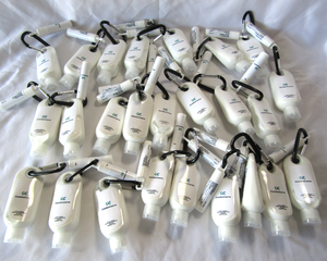 lot 12 image: NEW Promotional gift sets - Lip moisturizer, Carabineer, Sun screen lotion, 25 total