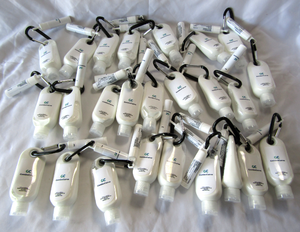 lot 13 image: NEW Promotional gift sets - Lip moisturizer, Carabineer, Sun screen lotion, 25 total