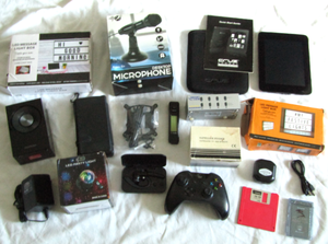 lot 72 image: Various Electronic Devices Including USB Desktop Microphone, Xbox Controller, and CRUZ eBook Reader