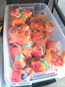 lot 86 image: NIB plastic tote full of plushy toy dogs each in unopened pack (Tote with lid included)