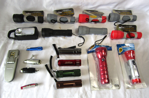 lot 122 image: Assorted mini tactical flashlights, several are new