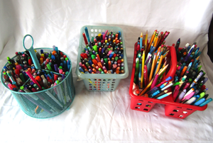 lot 131 image: Assorted pens, pencils, markers in carriers. Generous quantity