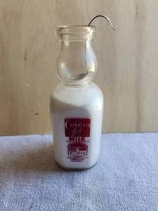 lot 185 image: Vintage square glass milk bottle with creamer - Carnation Milk - Quart - with rare Cream top creamer spoon