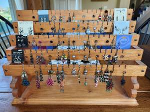 lot 198 image: Wood earring stand with generous selection of earrings
