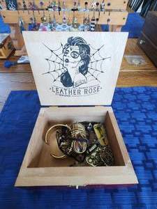 lot 227 image: Vintage Leather Rose tobacco box with various healing stone and crystal jewelry and a few alien themed necklaces