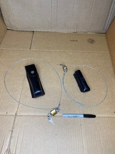 lot 40 image: Lot Of 4 - Security Items CablesLocksKeys And Leather Cases - In Condition As Shown